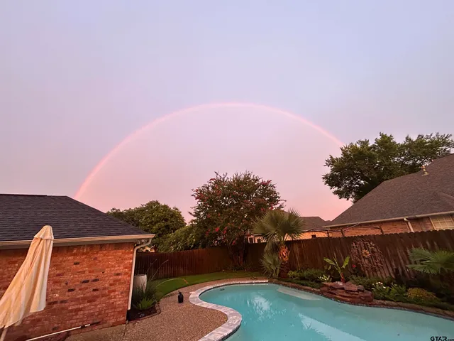 a view of a yard in front of the house