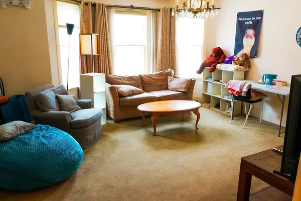 a living room with furniture and a window