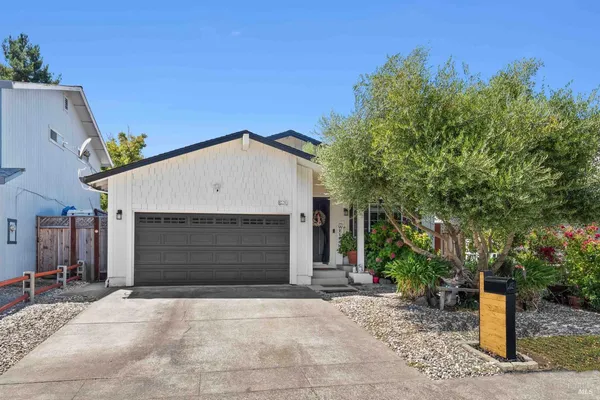 a front view of a house with a garage