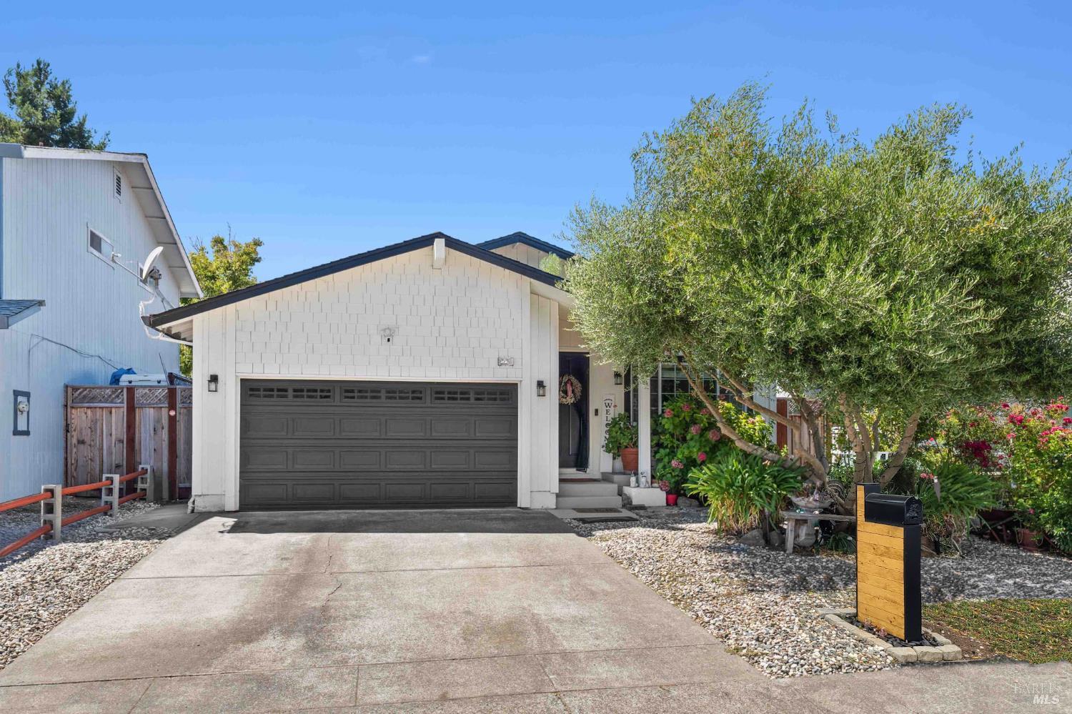 a front view of a house with a garage