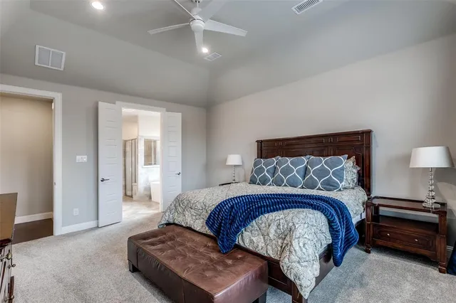 a spacious bathroom with a tub shower and sink