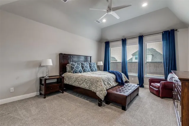 a spacious bathroom with a double vanity sink a mirror and a shower