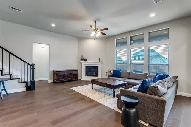 a living room with furniture fireplace and a table