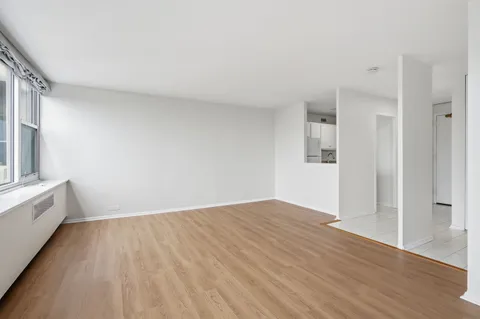 a white refrigerator freezer sitting inside of a kitchen