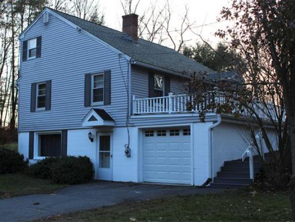115 Mill Road Chelmsford, MA 01824 - Photo 2 of 22 a front view of a house with a yard