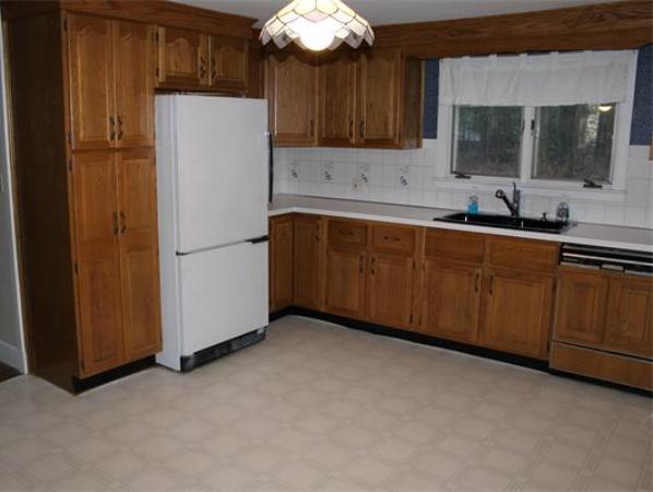 115 Mill Road Chelmsford, MA 01824 - Photo 5 of 22 a kitchen with stainless steel appliances a refrigerator and a sink