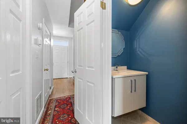 a view of bathroom with a sink toilet and window