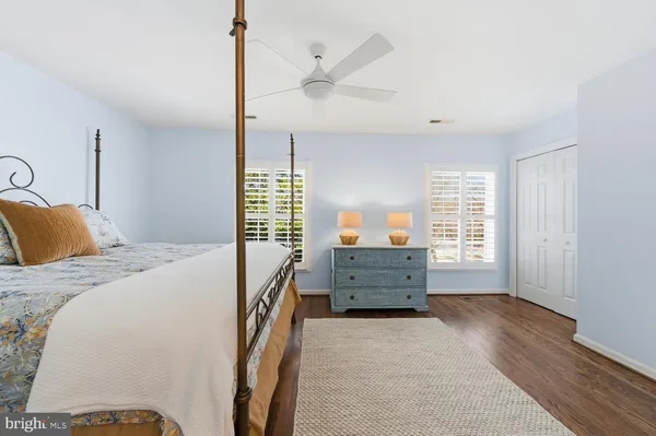 a bed room with a bed and a window