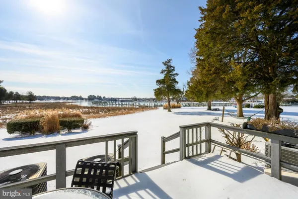a view of a lake with couches and city view