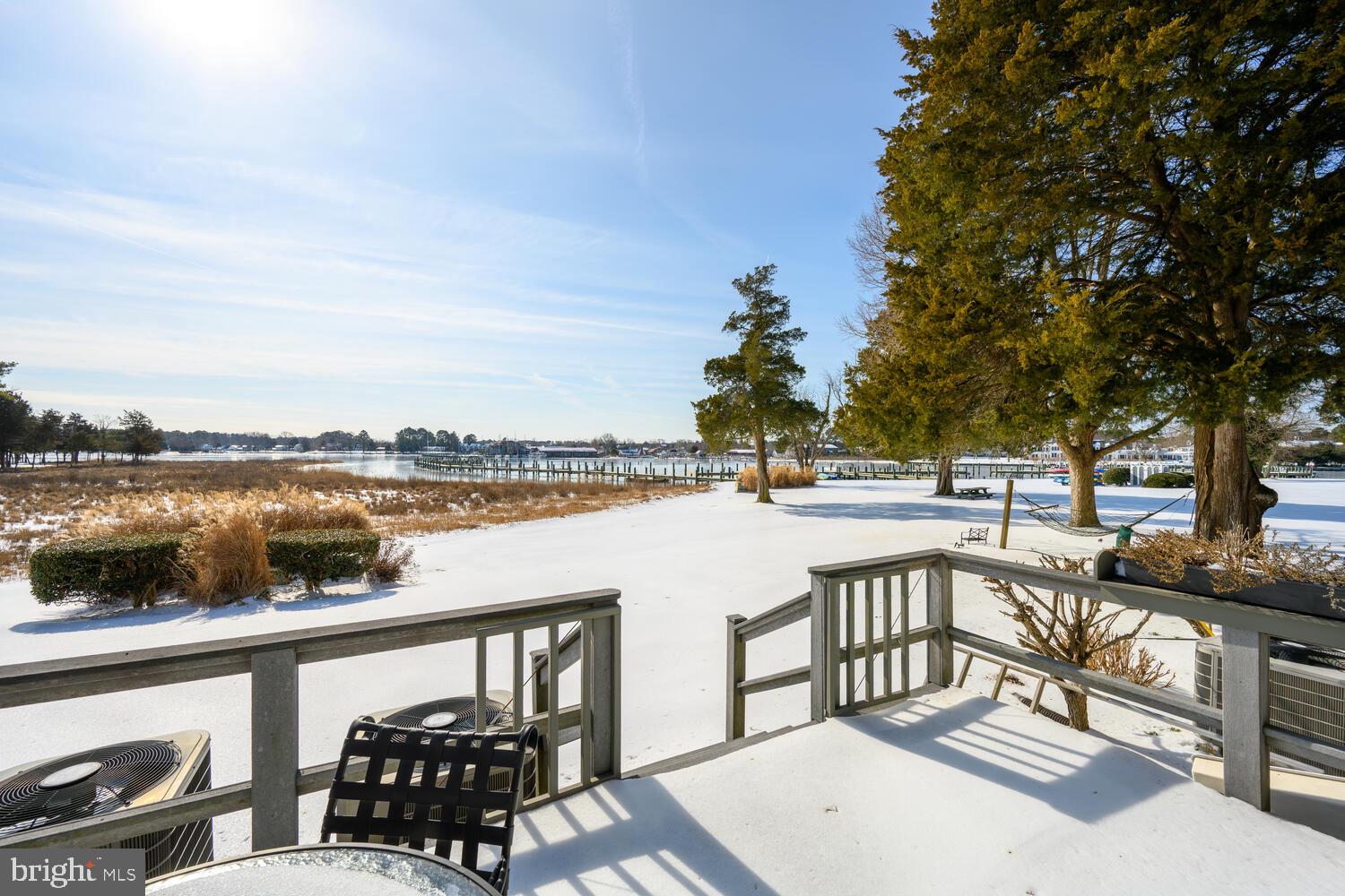 320 Perry Cabin Drive St. Michaels, MD 21663 - Photo 3 of 50 a view of a lake with couches and city view