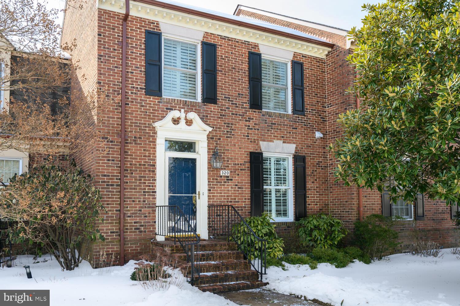 320 Perry Cabin Drive St. Michaels, MD 21663 - Photo 36 of 50 front view of a brick house with a small yard