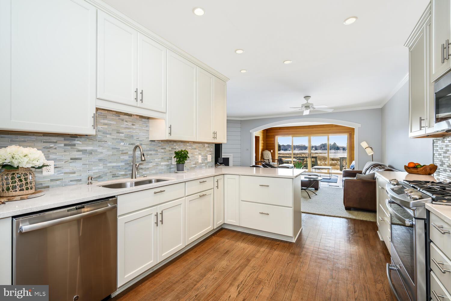 320 Perry Cabin Drive St. Michaels, MD 21663 - Photo 6 of 50 a kitchen with stainless steel appliances a stove a sink dishwasher and a refrigerator