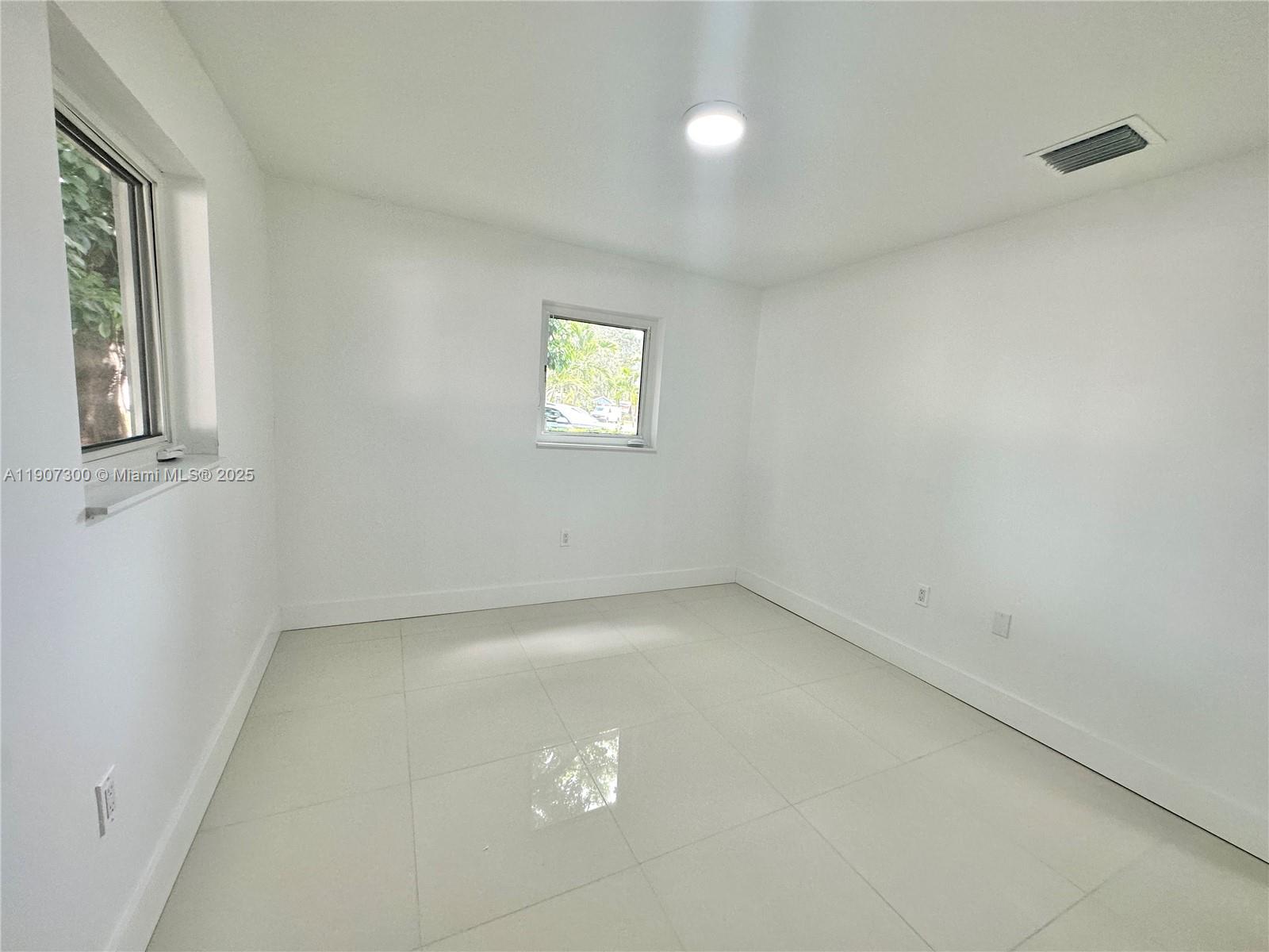 5740 Freedom Street Hollywood, FL 33021 - Photo 15 of 44 an empty room with a window
