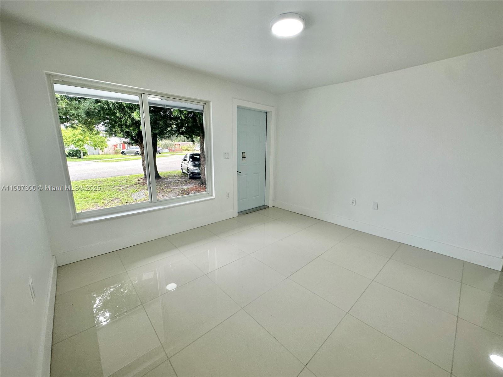 5740 Freedom Street Hollywood, FL 33021 - Photo 28 of 44 a view of an empty room with a window