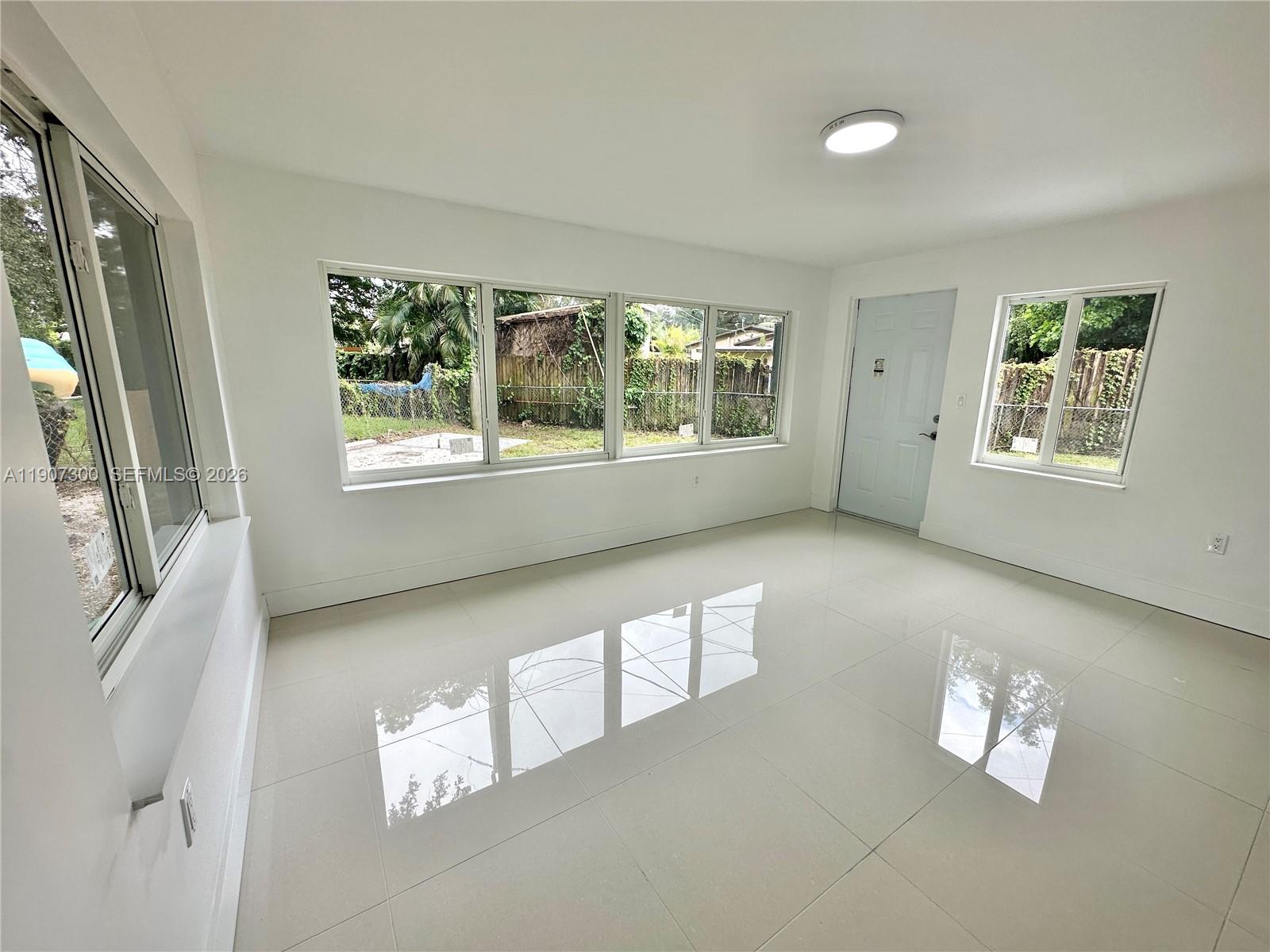 5740 Freedom Street Hollywood, FL 33021 - Photo 29 of 43 a view of an empty room with a window