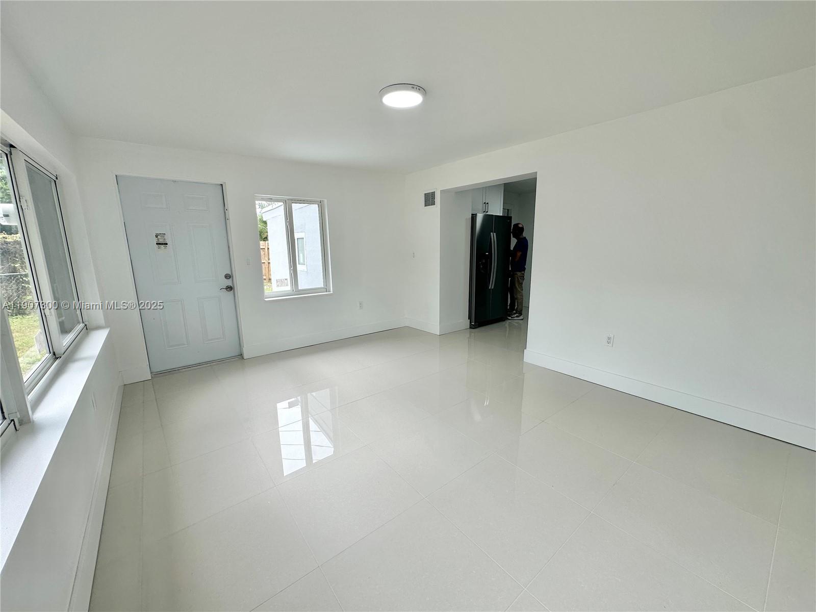 5740 Freedom Street Hollywood, FL 33021 - Photo 31 of 44 an empty room with windows and closet