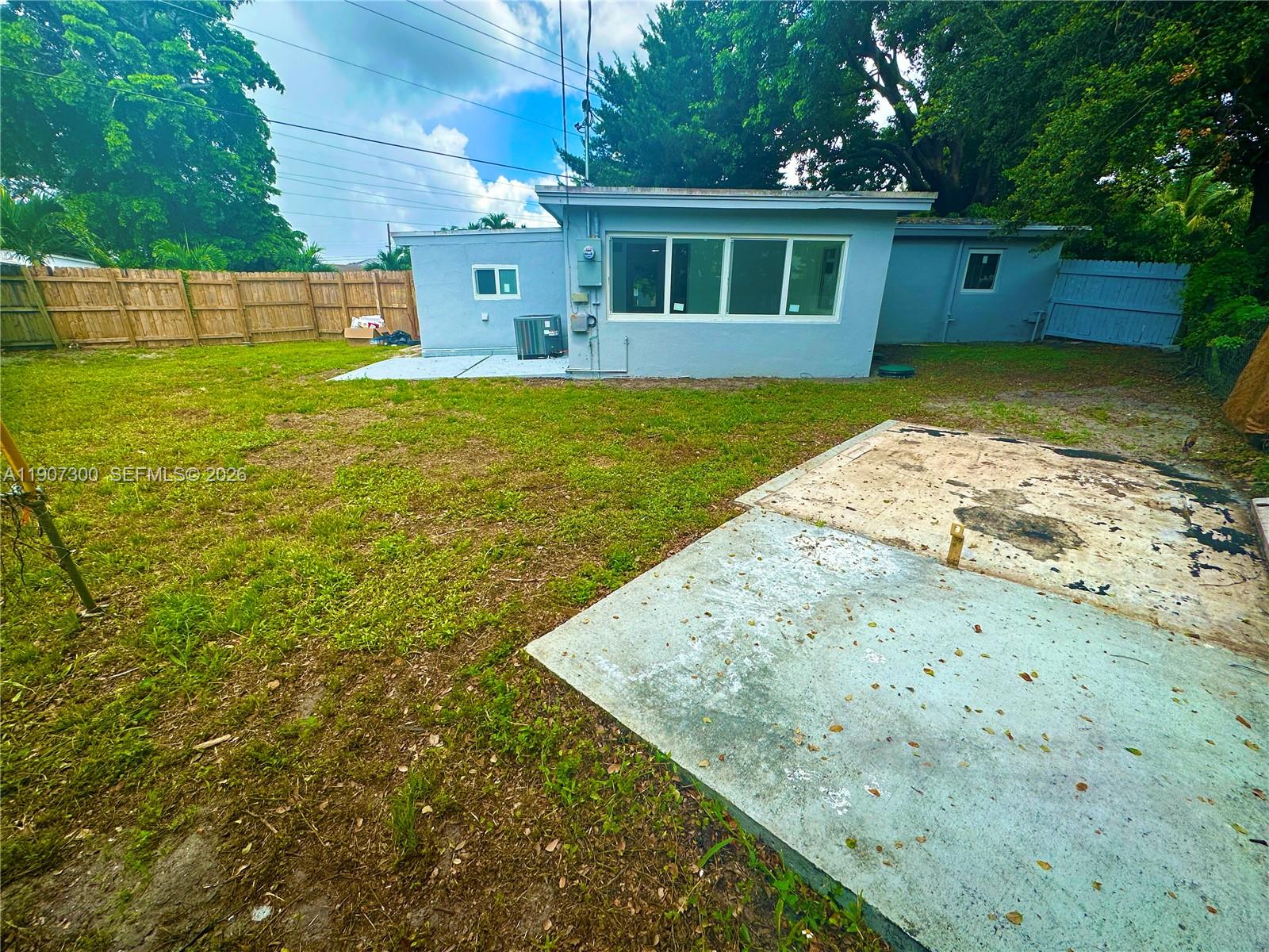 5740 Freedom Street Hollywood, FL 33021 - Photo 32 of 43 a view of a yard with a house