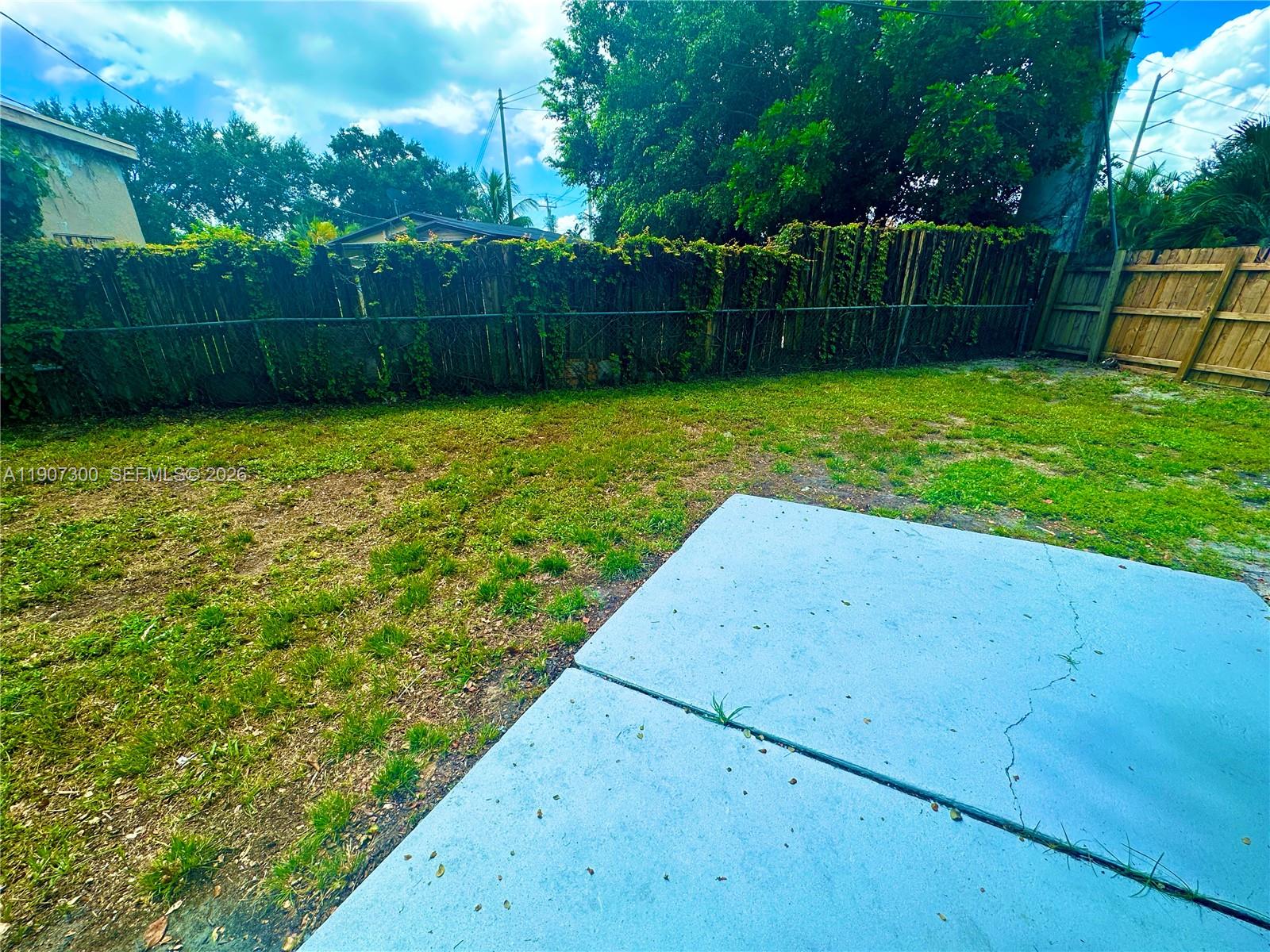 5740 Freedom Street Hollywood, FL 33021 - Photo 35 of 43 a view of a backyard with a swing