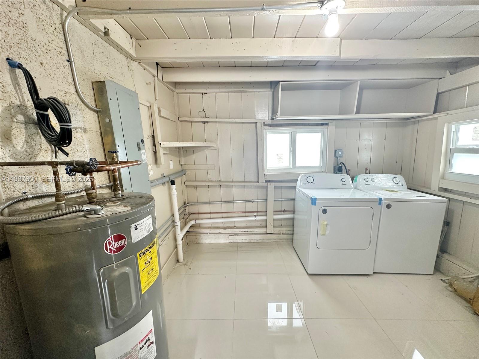 5740 Freedom Street Hollywood, FL 33021 - Photo 38 of 43 a utility room with cabinets