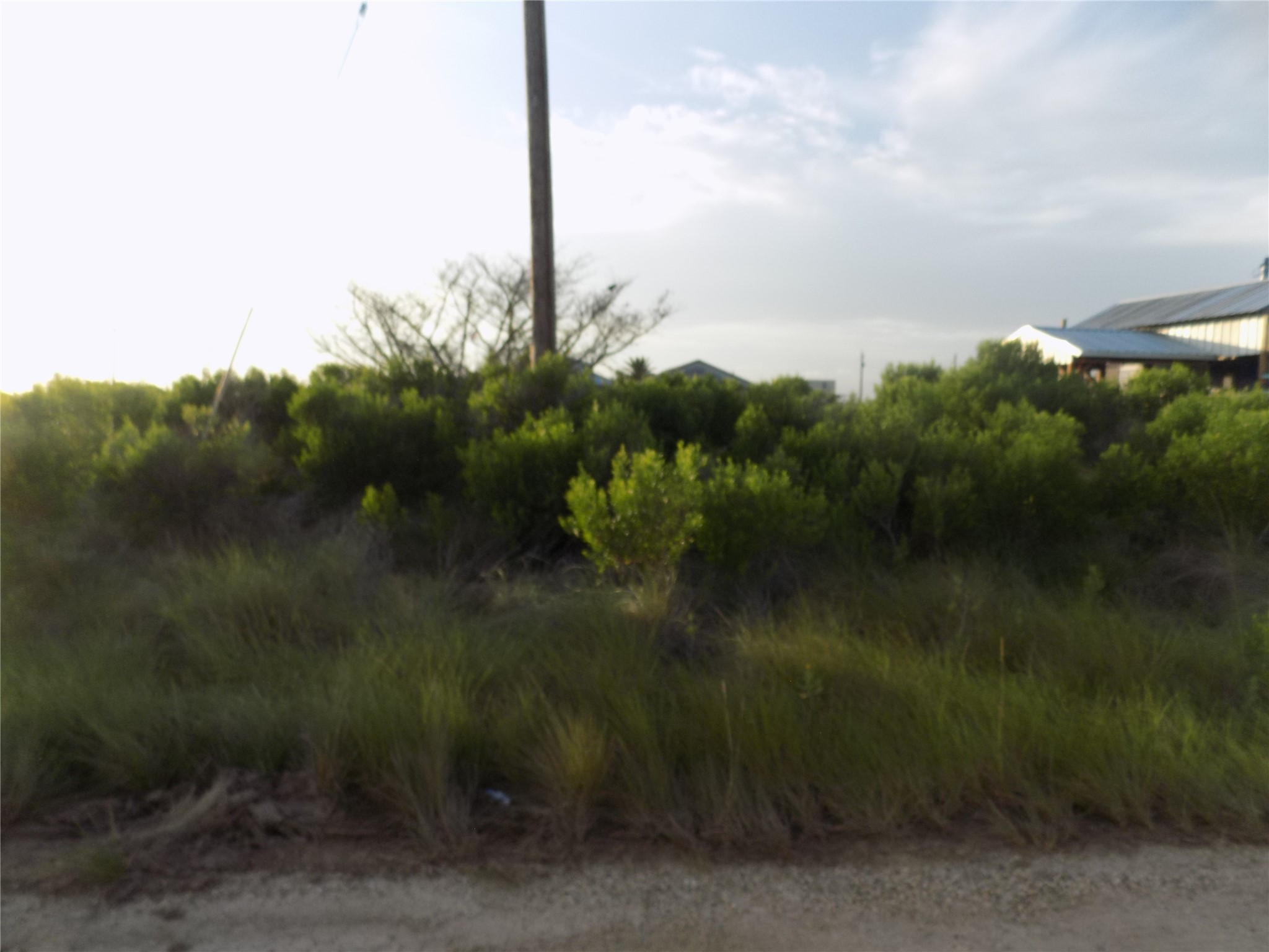 14581 Barracuda Street Sargent, TX 77414 - Photo 1 of 4 Unimproved waterfront lot. 2nd lot in from the paved road