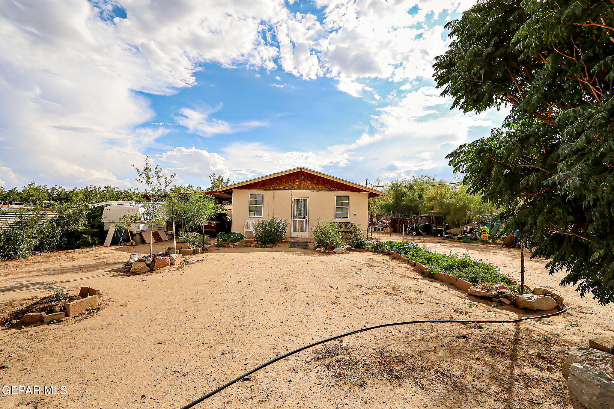 a view of a house with a yard covered in snow