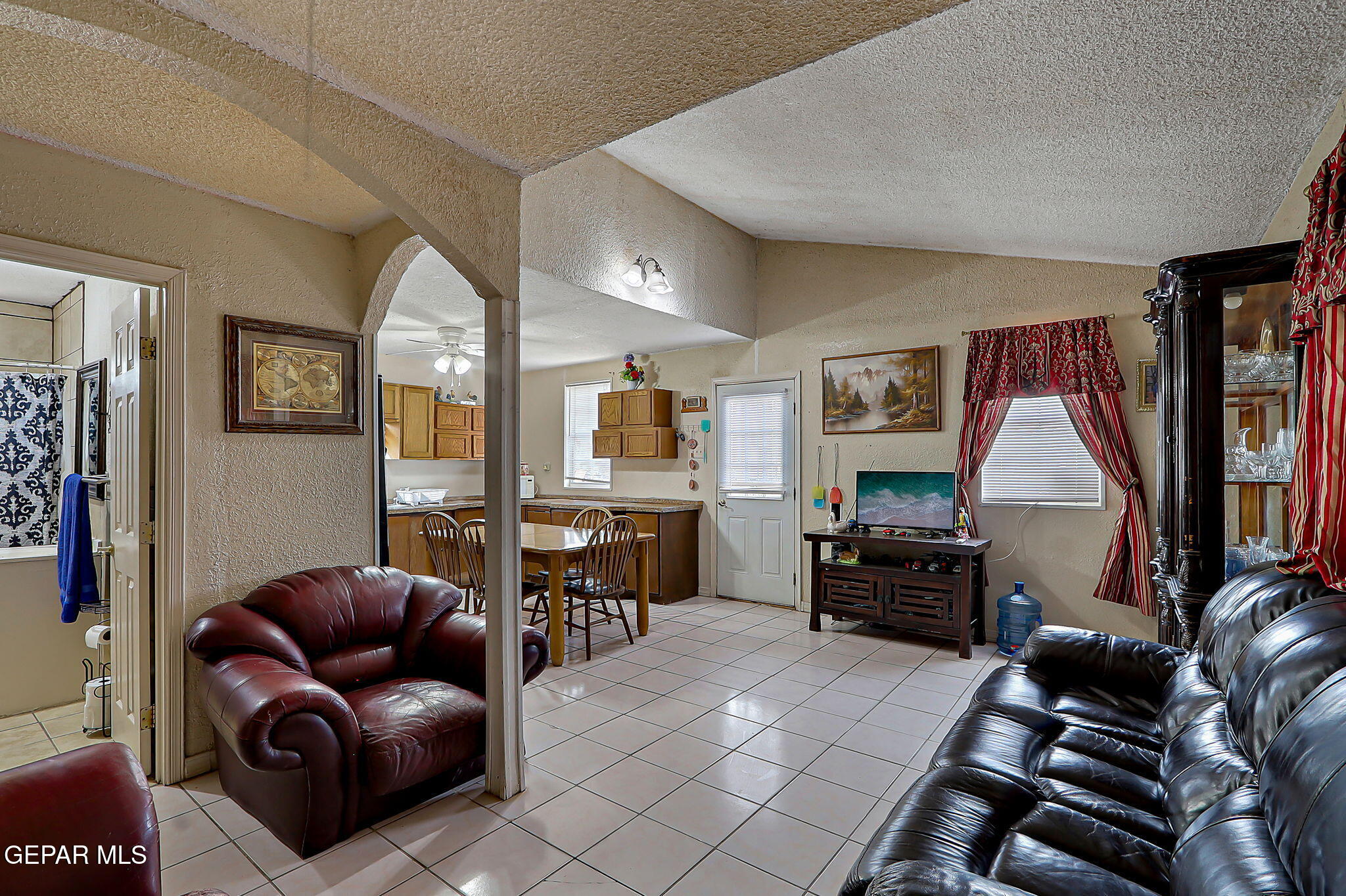 19210 Rancho Road Tornillo, TX 79853 - Photo 3 of 14 a living room with furniture and a flat screen tv