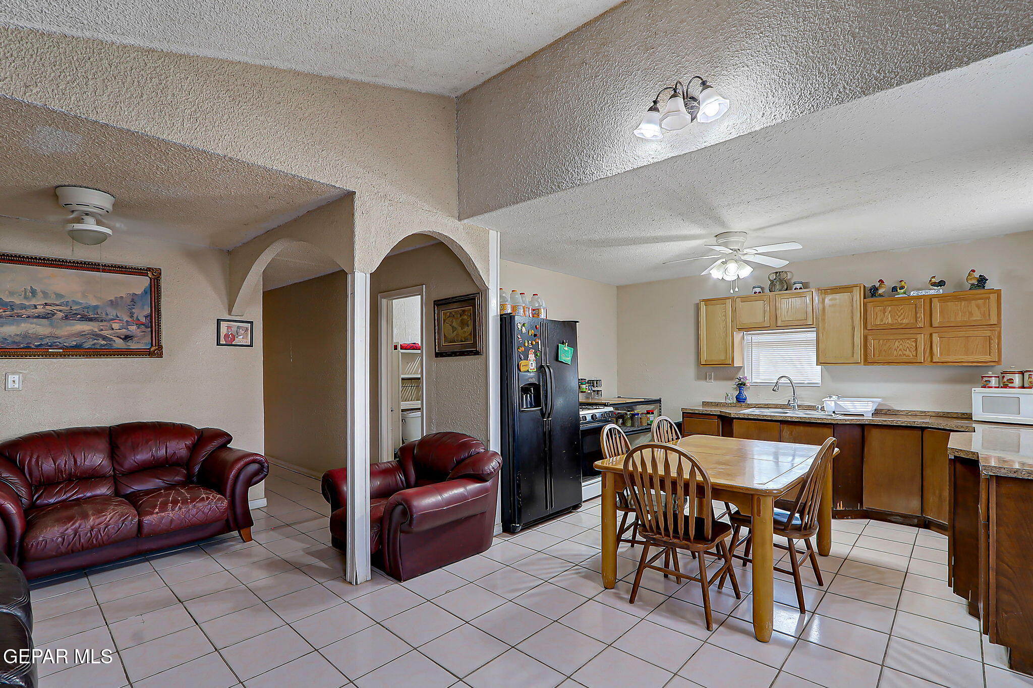 19210 Rancho Road Tornillo, TX 79853 - Photo 5 of 14 a living room with furniture a table and kitchen view