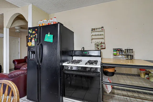 a kitchen with stainless steel appliances granite countertop a stove and a sink