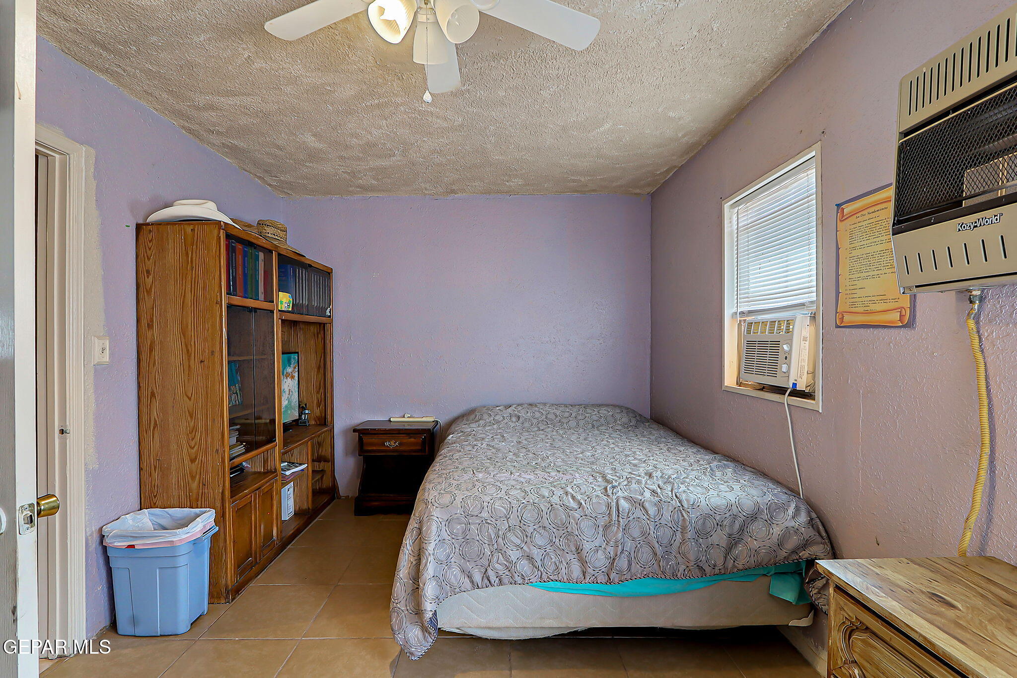 19210 Rancho Road Tornillo, TX 79853 - Photo 8 of 14 a bedroom with a bed and wooden floor