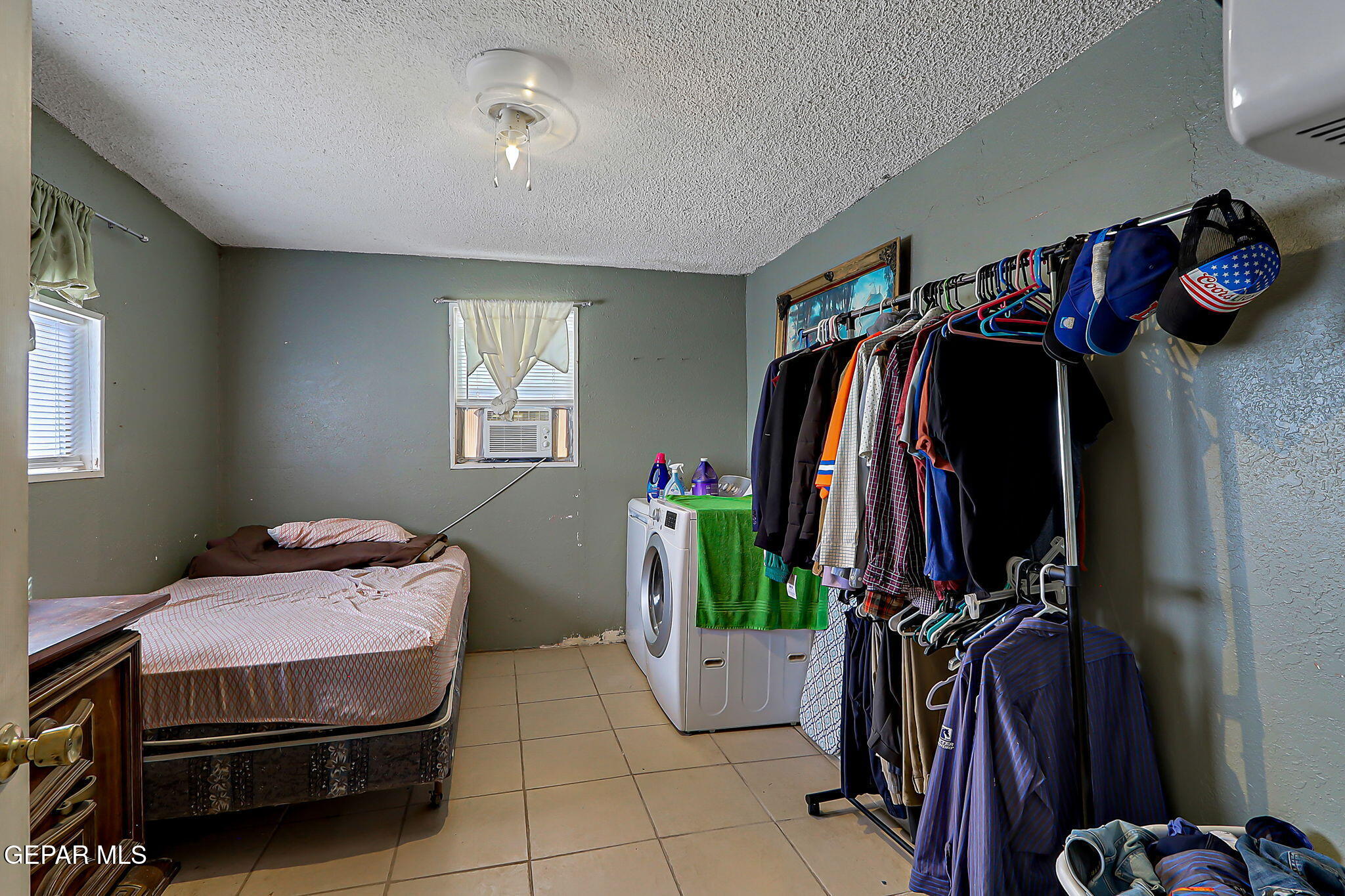 19210 Rancho Road Tornillo, TX 79853 - Photo 9 of 14 a living room with furniture and a walk in closet