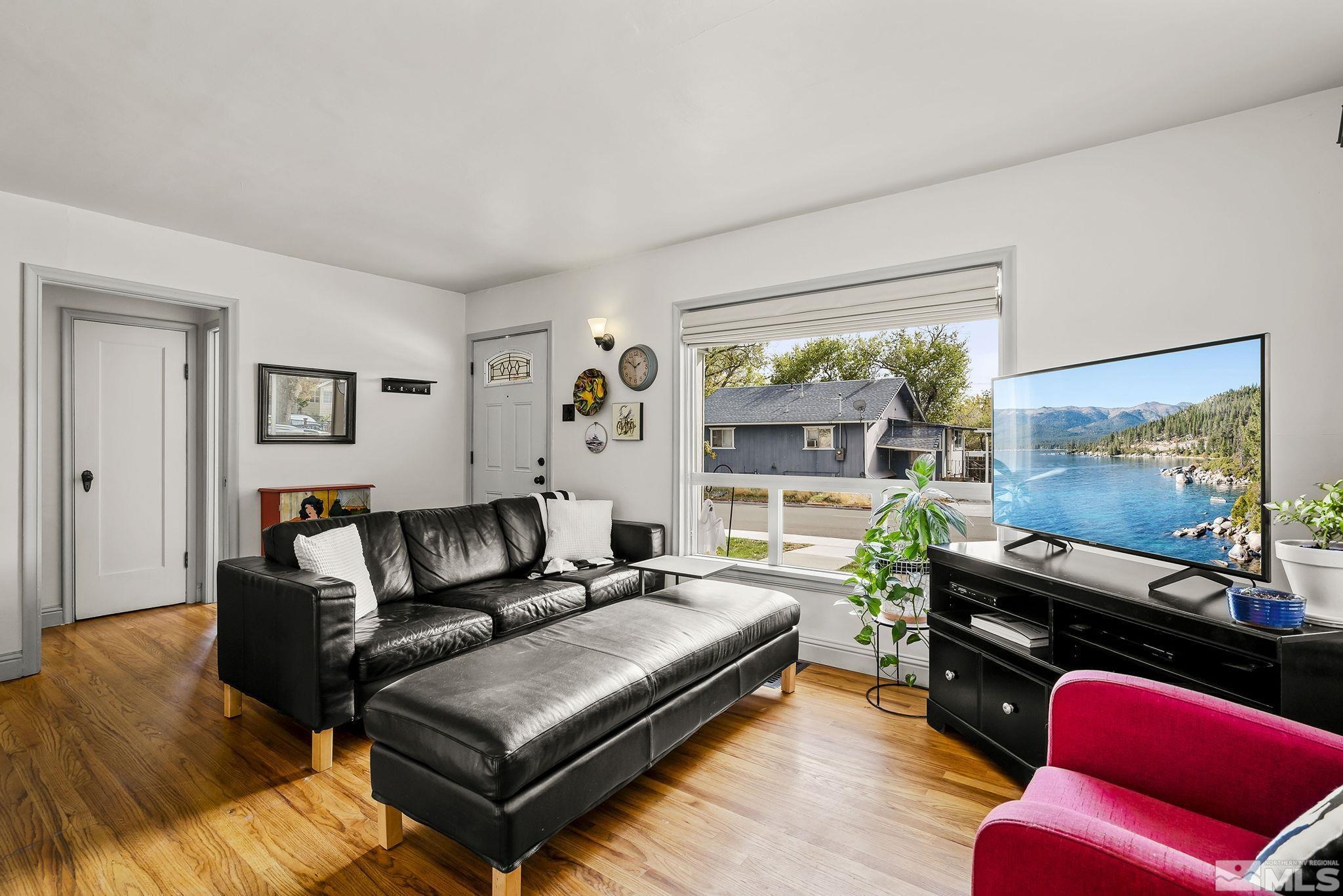 629 West 11th Street, Unit RENO Reno, NV 89503 - Photo 5 of 18 a living room with furniture and a flat screen tv