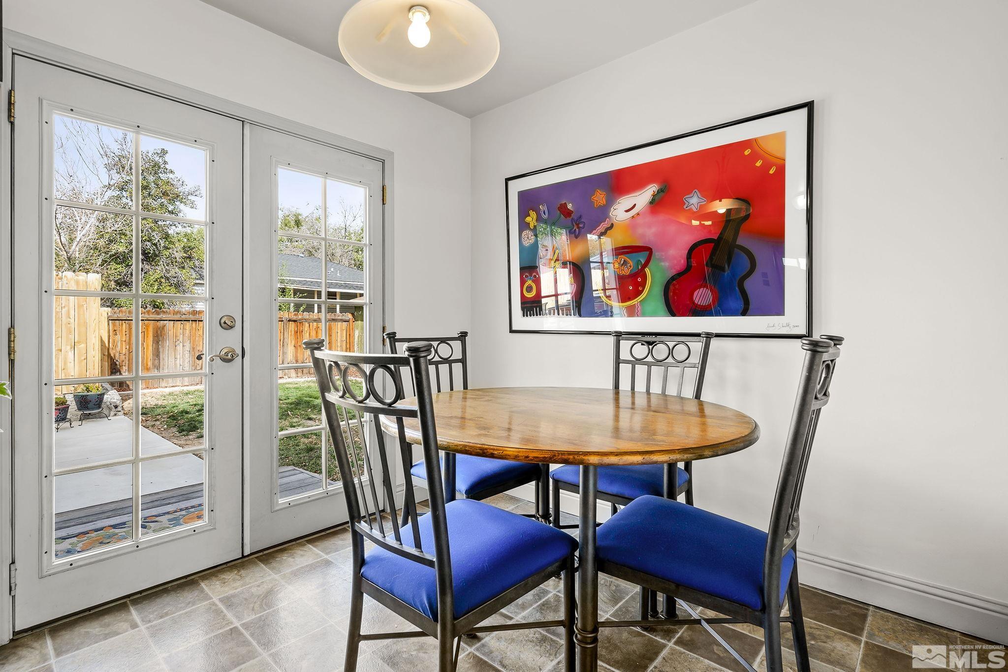 629 West 11th Street, Unit RENO Reno, NV 89503 - Photo 6 of 18 a view of a dining room with furniture wooden floor and a potted plant