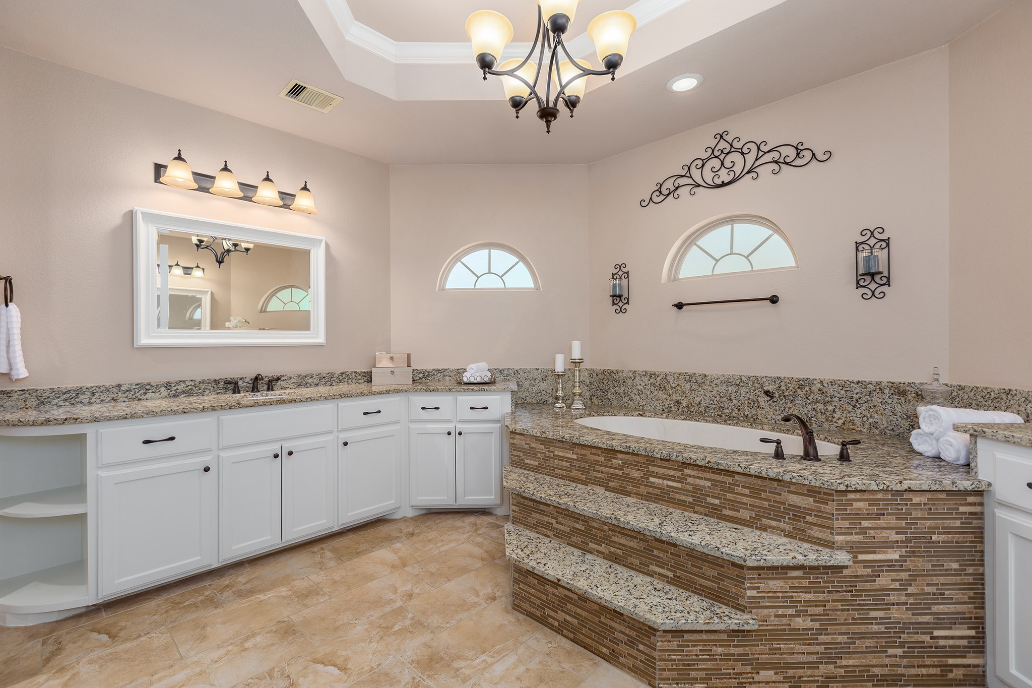 27688 Rio Blanco Drive Splendora, TX 77372 - Photo 25 of 50 a spacious bathroom with a granite countertop sink mirror and a bathtub