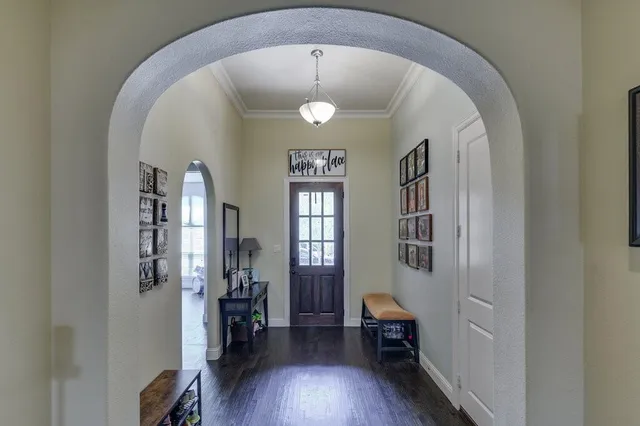 a view of a livingroom with furniture and hardwood floor