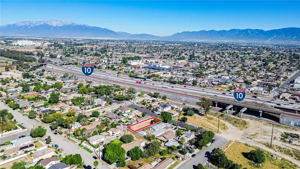 an aerial view of a residential houses and city street
