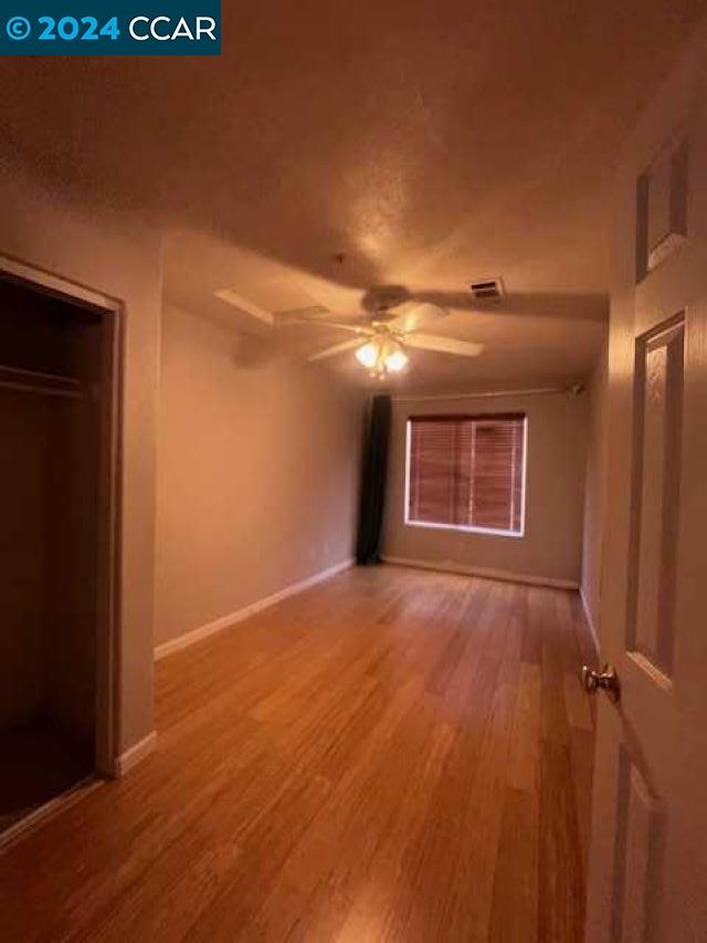 29160 Whitegate Lane Highland, CA 92346 - Photo 11 of 27 a view of an empty room with wooden floor