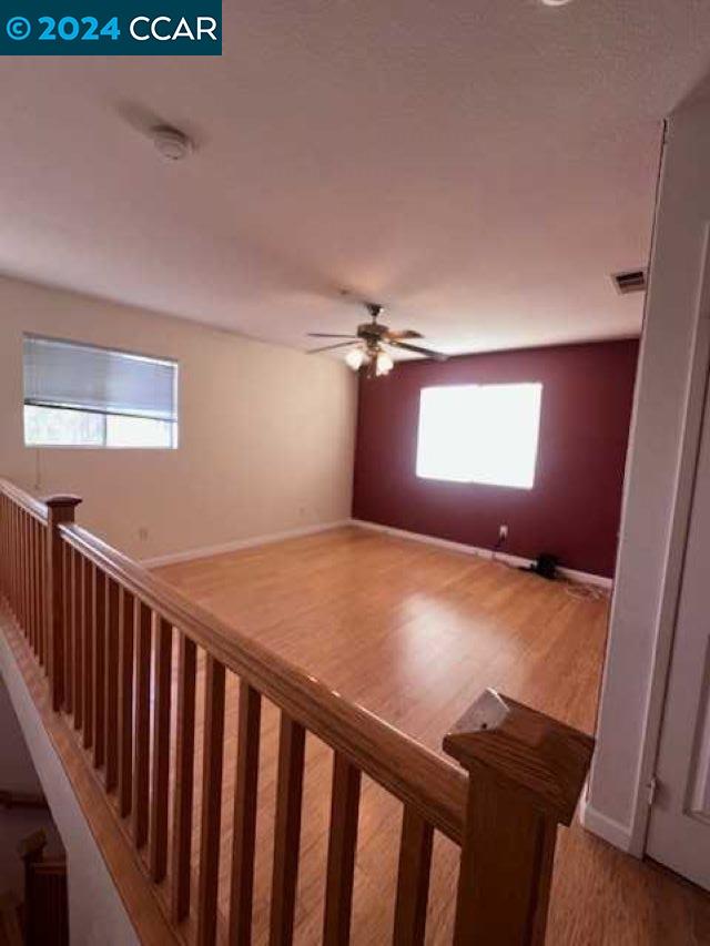 29160 Whitegate Lane Highland, CA 92346 - Photo 14 of 27 a bedroom with a bed and wooden floor