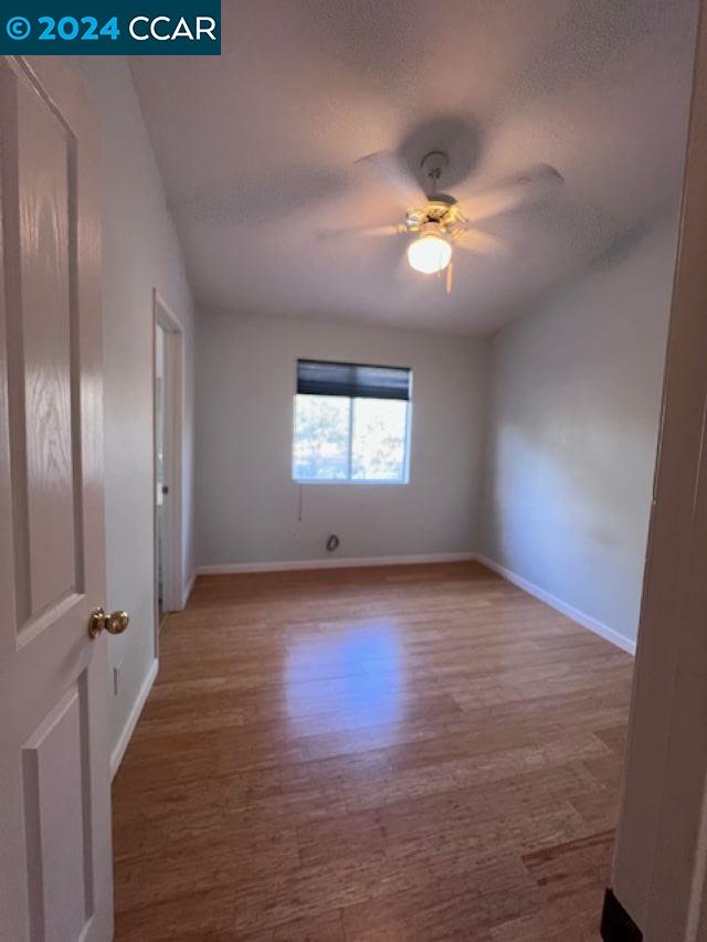 29160 Whitegate Lane Highland, CA 92346 - Photo 17 of 27 a view of empty room with wooden floor