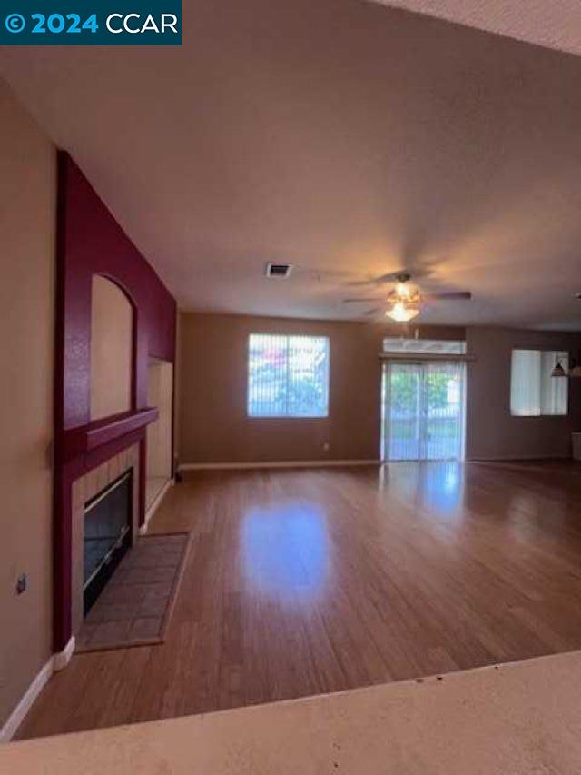 29160 Whitegate Lane Highland, CA 92346 - Photo 4 of 27 wooden floor in an empty room with a window