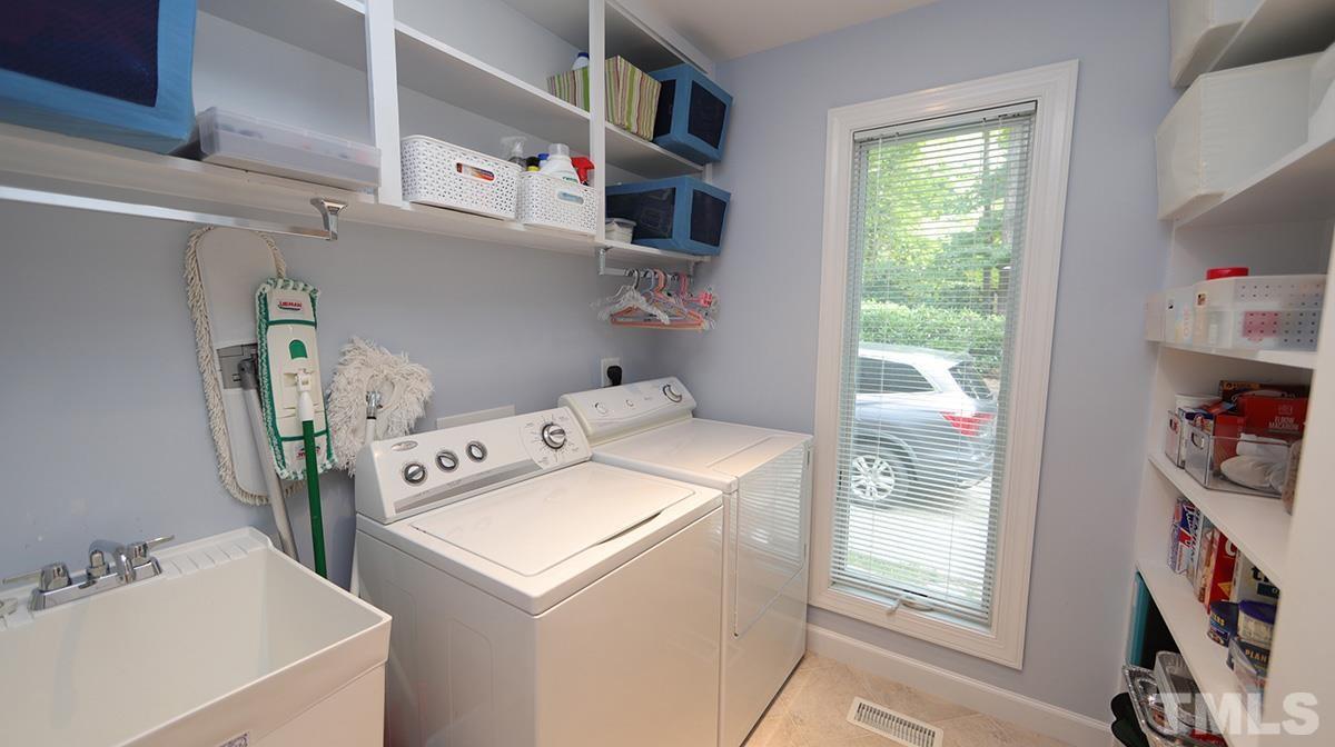 8837 Woodyhill Road Raleigh, NC 27613 - Photo 11 of 26 Very spacious laundry room- pantry!