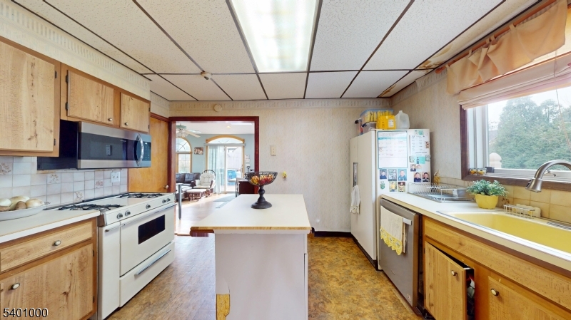 237 Winfield Terrace Union, NJ 07083 - Photo 11 of 21 a kitchen that has a sink a stove top oven a cabinetry and a potted plant