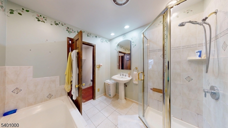 237 Winfield Terrace Union, NJ 07083 - Photo 13 of 21 a bathroom with a bathtub shower sink and toilet