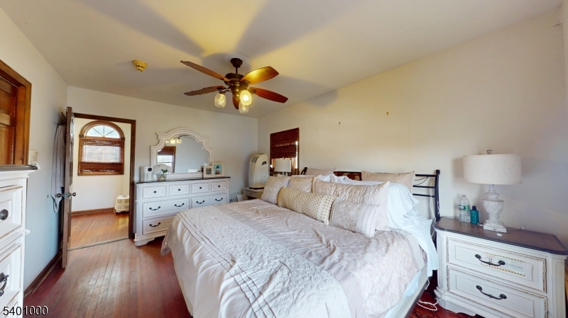 237 Winfield Terrace Union, NJ 07083 - Photo 14 of 21 a bedroom with a bed and a tv on the dresser