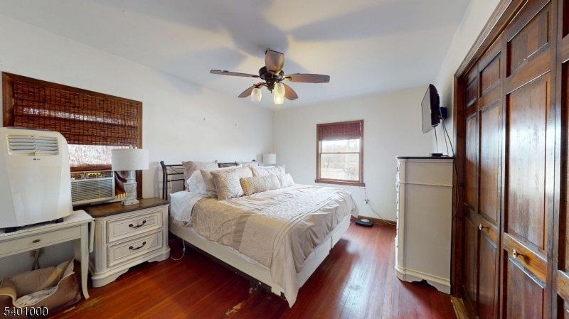 237 Winfield Terrace Union, NJ 07083 - Photo 15 of 21 a bedroom with a bed and a flat tv screen on dresser