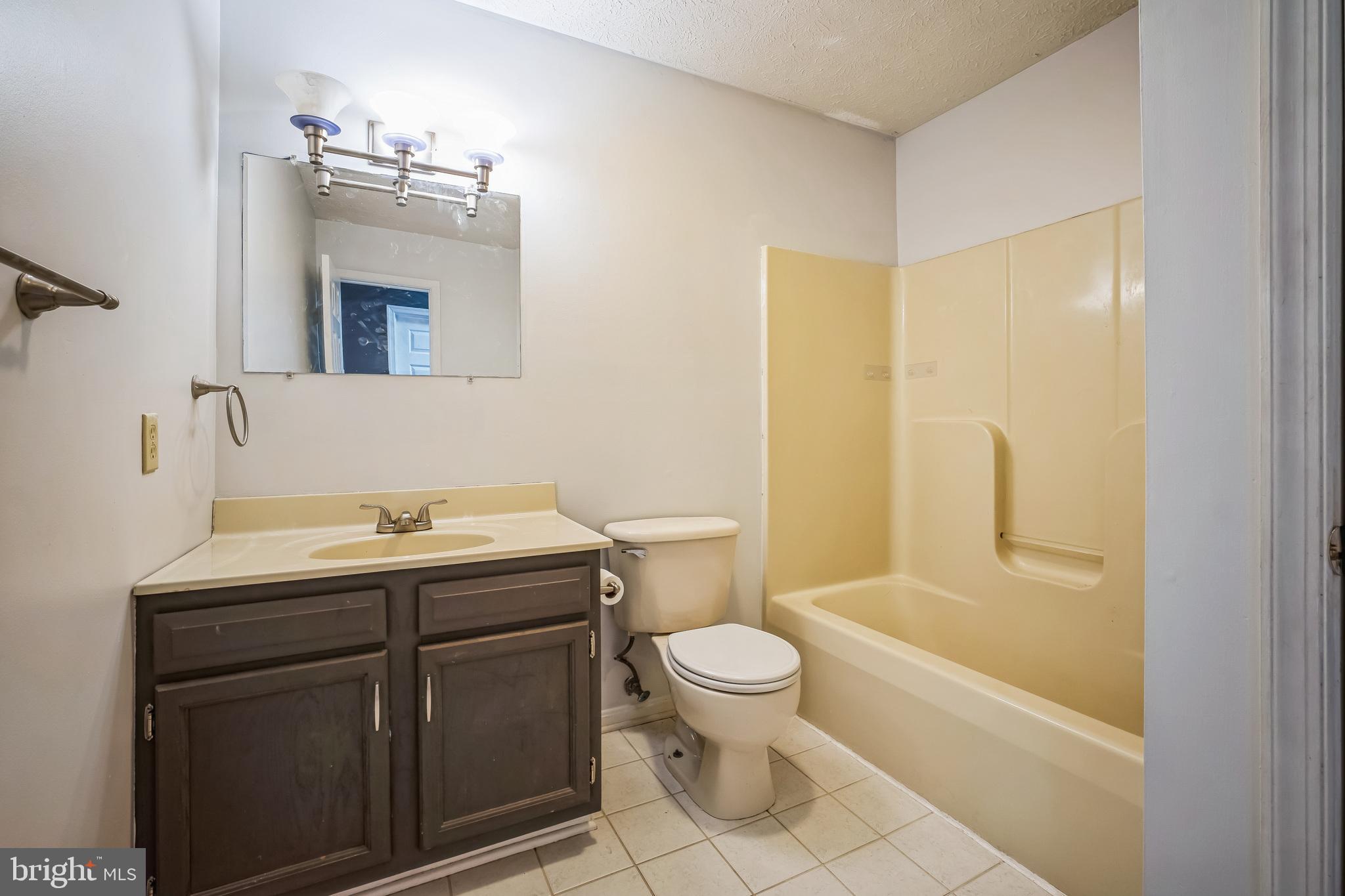 1270 High Top Road Linden, VA 22642 - Photo 12 of 30 a bathroom with a granite countertop sink toilet and shower