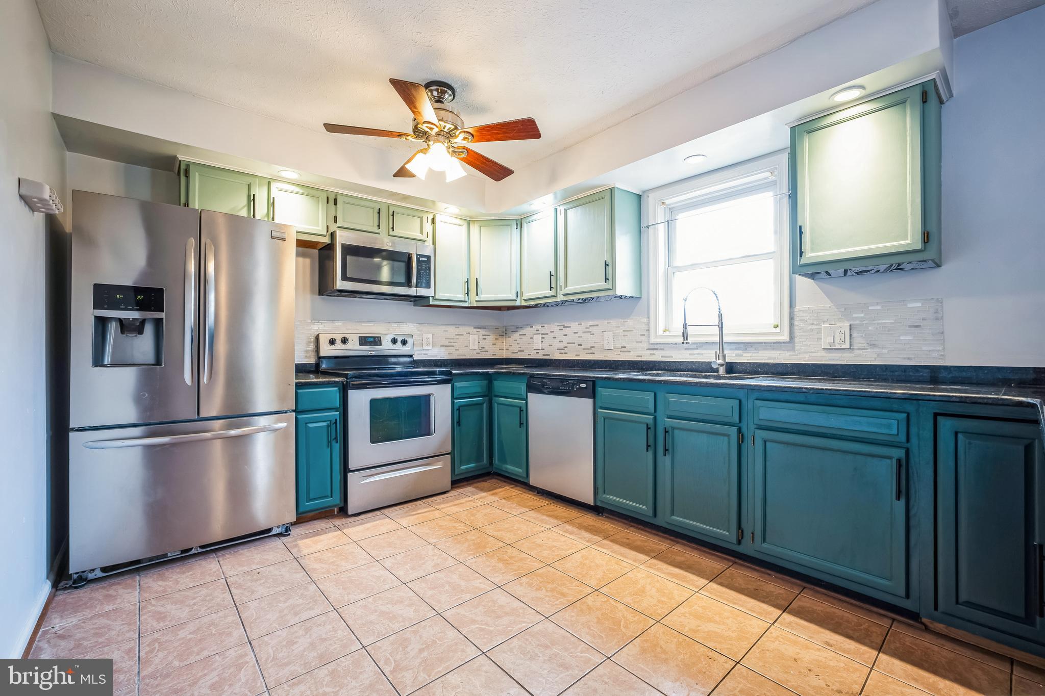 1270 High Top Road Linden, VA 22642 - Photo 9 of 30 a kitchen with stainless steel appliances granite countertop a refrigerator and a sink