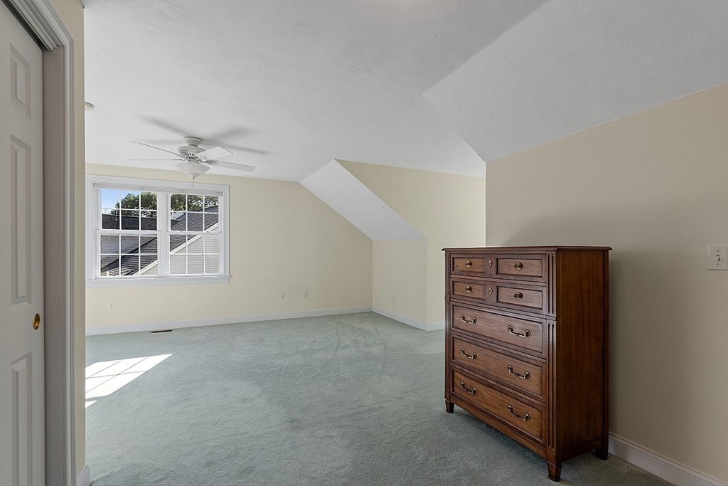 94 Summer Road, Unit 94 Boxborough, MA 01719 - Photo 25 of 35 an empty room with windows and closet