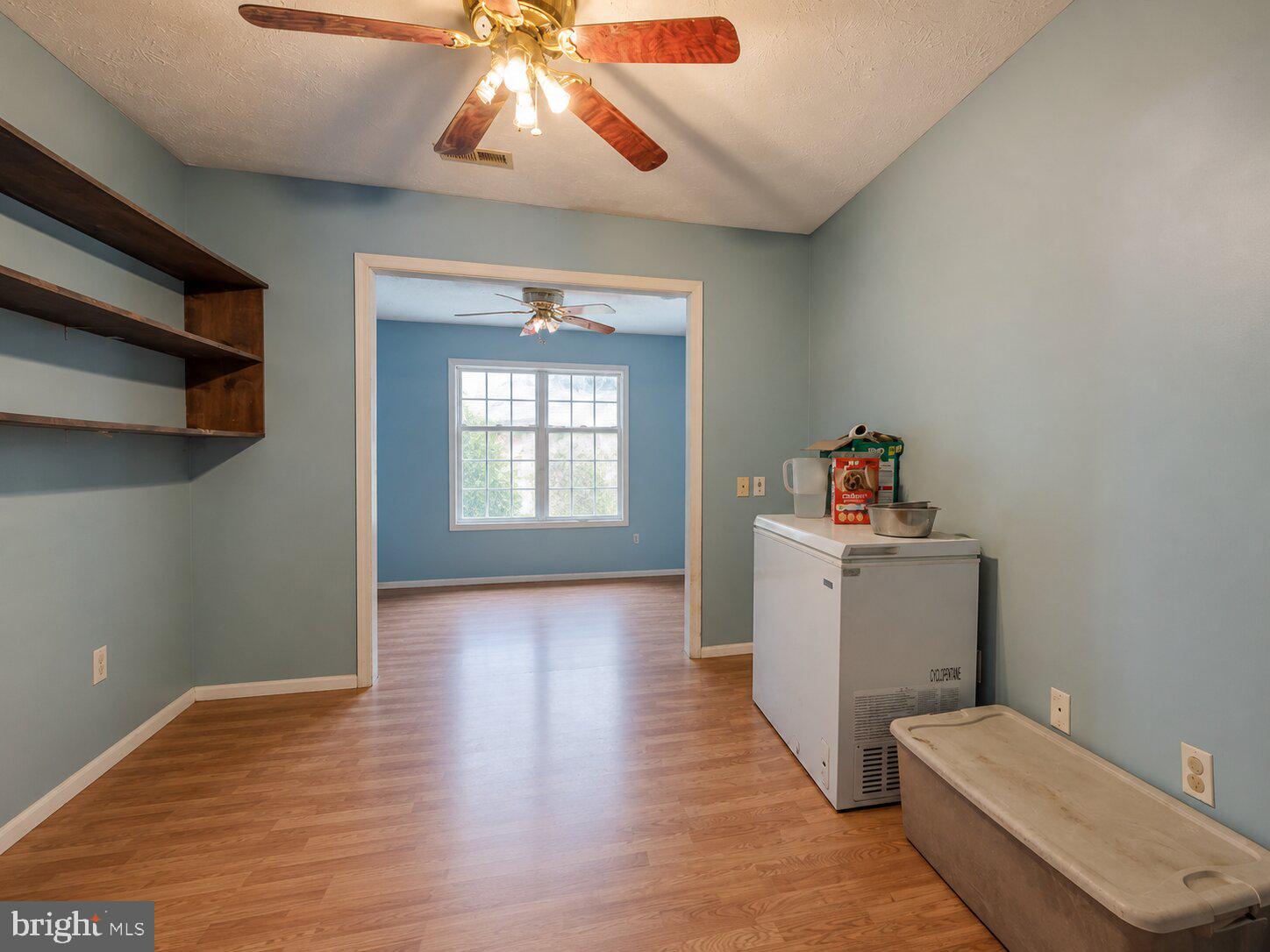 11419 Oak Grove Road Bristol, VA 24202 - Photo 23 of 36 a view of kitchen and hall with wooden floor