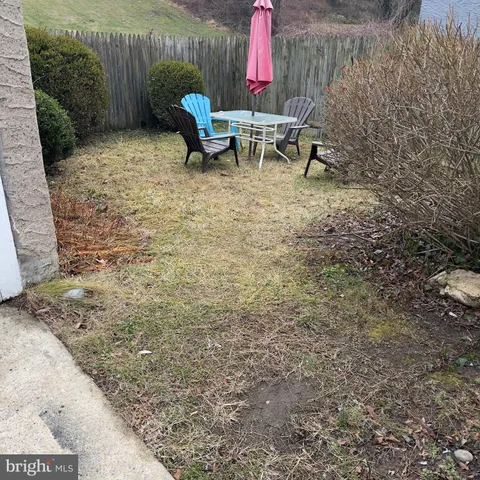 a view of a backyard with sitting area