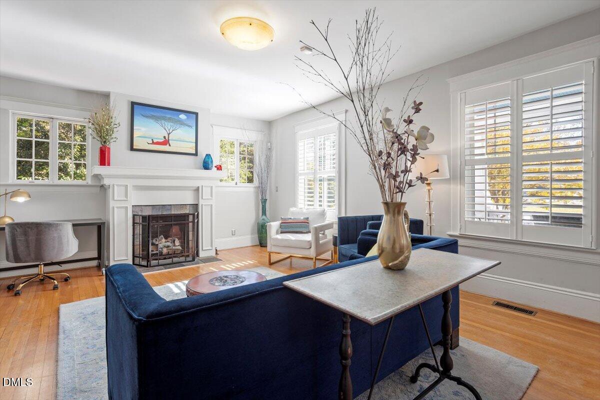 807 East Edenton Street Raleigh, NC 27601 - Photo 13 of 69 a living room with furniture and a fireplace